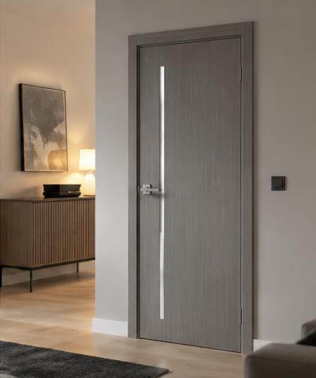 Grey flush interior door with a vertical handle